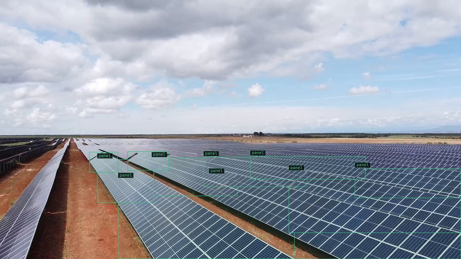 Drone pass along a solar farm, panels boxed with straight boxes across the rows, from a customer drone survey