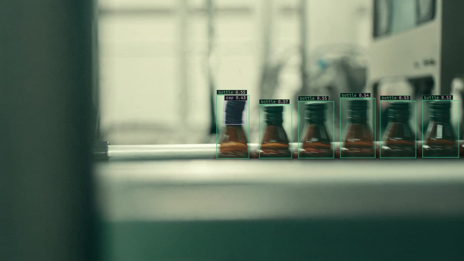 Bottling line with bottles queued under a fill head and one missing its cap, bottle and cap boxed, generated scene with detections from our model