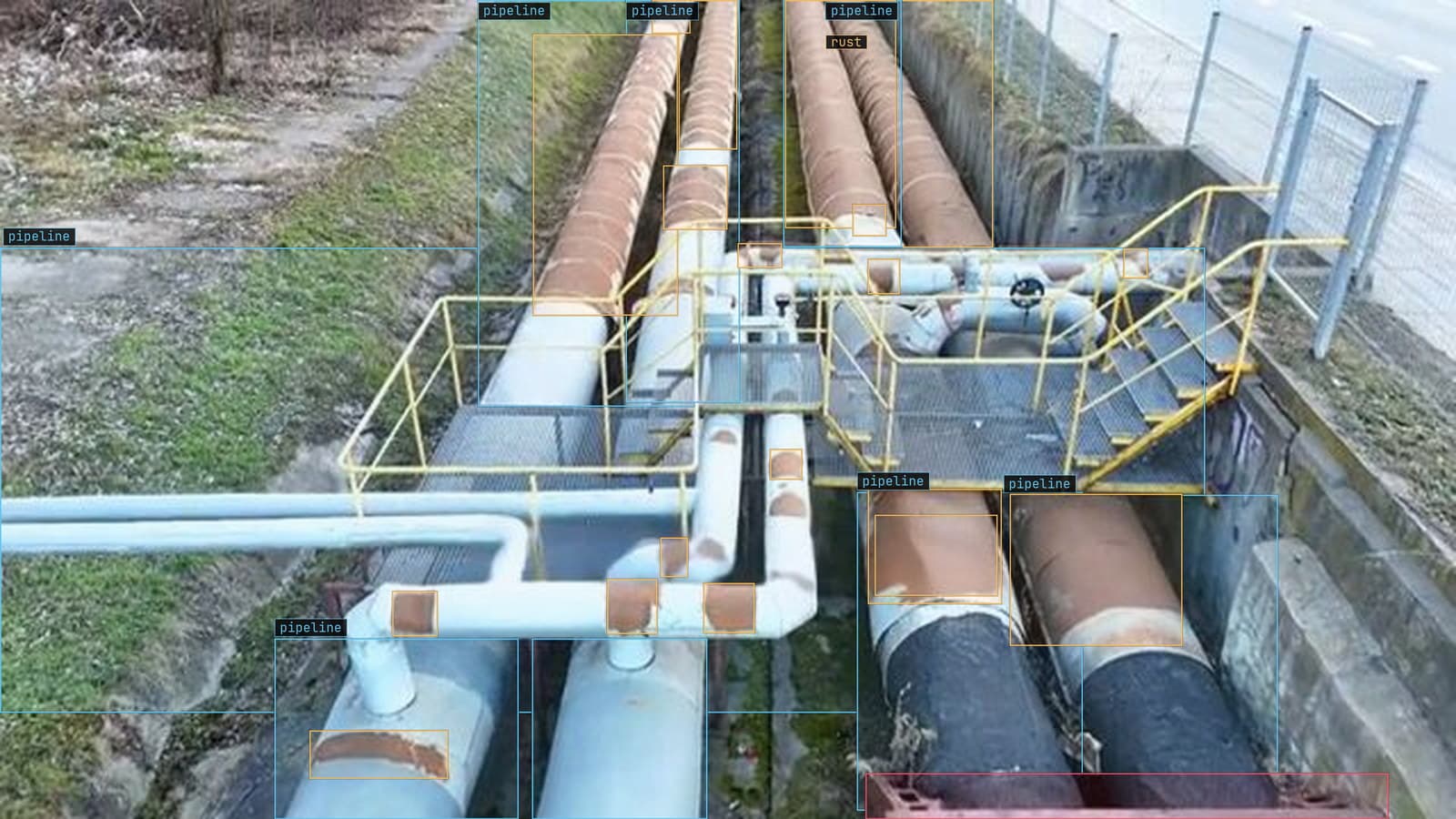 Pipe rack from above, rust boxed along the lines and two dents flagged, from a customer inspection run