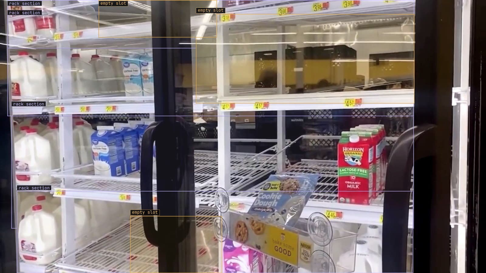 Dairy case with three empty slots flagged, from a customer store camera
