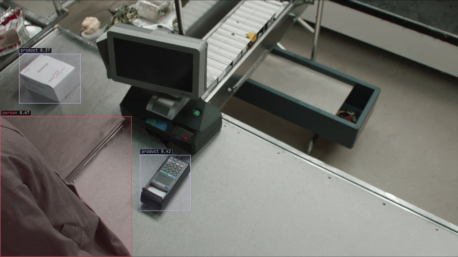 Checkout lane from a ceiling camera, a person and the products on the belt boxed, generated scene with detections from our model